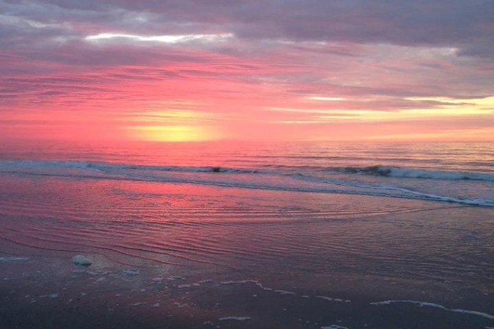 a sunset over a body of water