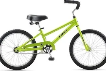 a bicycle leaning against a wall