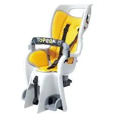 Child bike seat with yellow padding and safety harness on a white frame.